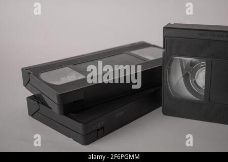 Three VHS Video Tapes, Cassette, isolated on white background. Vintage, Retro concept with tapes used in the past to play and record film and footage Stock Photo