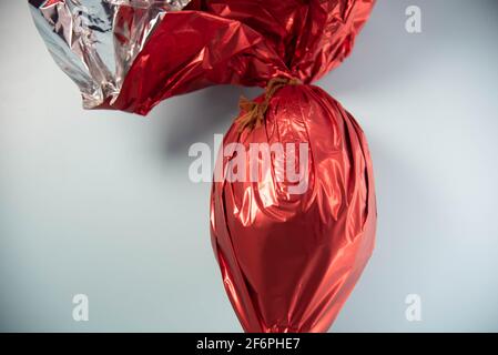 Chocolate egg packed for gift on Easter day. Christian holiday. Candy and mischief. Easter egg. Gift for children and adults. Bunny gifts in the Chris Stock Photo
