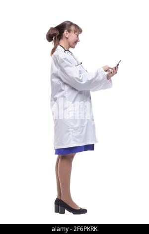 Side view of a doctor woman using a smart phone Stock Photo