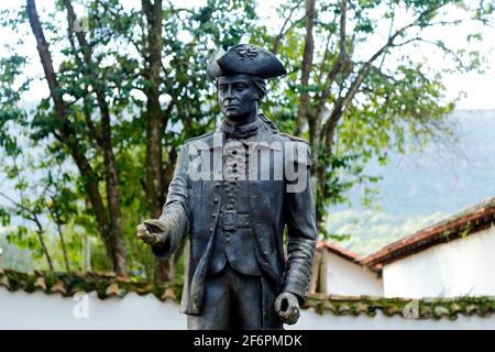 Tiradentes, Minas Gerais, Brazil - February 20, 2021: Tiradentes metal statue representing the young ensign on a public road Stock Photo