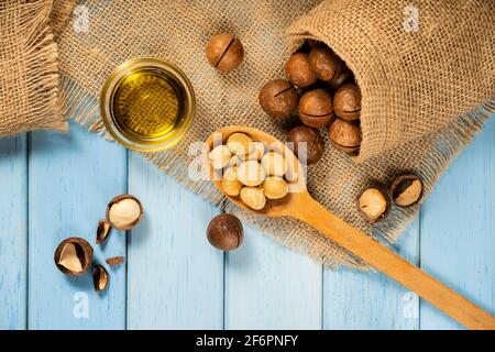 Macadamia nut, top view. Flatley. rustic style, space for text. An exotic product. Stock Photo