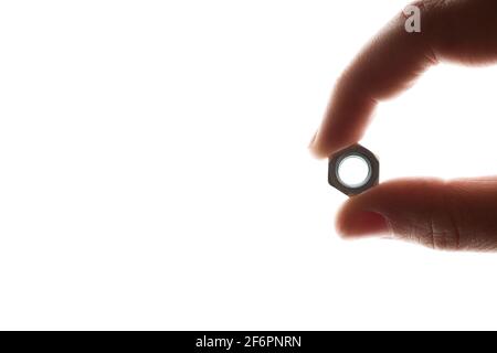 screw-nut in hands on a white background Stock Photo