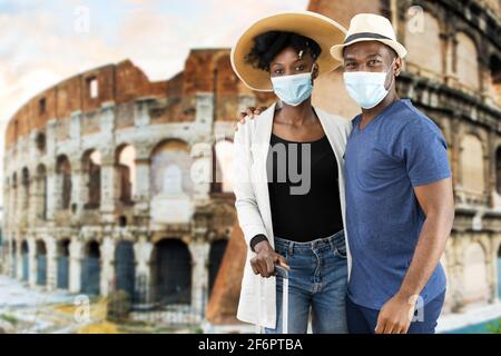 Young African Couple On Vacation In Rome Wearing Face Mask Stock Photo