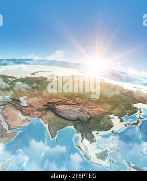 Sun shining through clouds, in blue sky, over a high detailed satellite view of Planet Earth, focused on Asia - Elements furnished by NASA Stock Photo