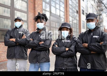 African American Security Officer At Event In Face Mask Stock Photo