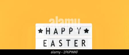 Top view banner Happy Easter text message ans greeting on lightbox Stock Photo