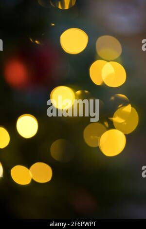 Abstract arrangement of diffused, soft focus Christmas Tree lights indoors Stock Photo