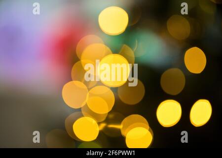 Abstract arrangement of diffused, soft focus Christmas Tree lights indoors Stock Photo