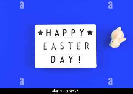 Happy Easter Day text on lightbox, festive background for holiday Stock Photo
