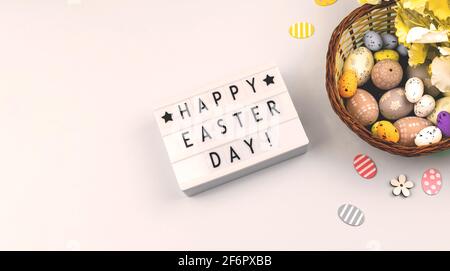 Happy Easter flat lay background with text, easter eggs, banner on a white background Stock Photo