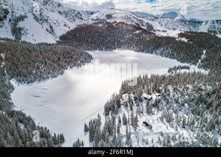 Palù Lake, Valmalenco (IT), Winter aerial view with fresh snow Stock Photo