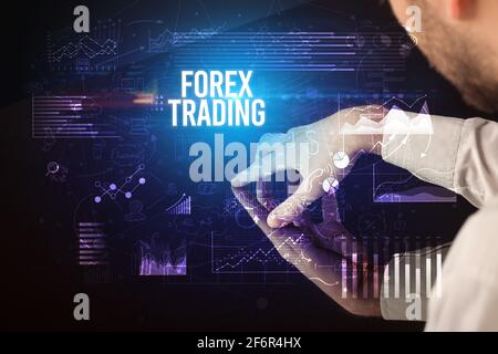Businessman touching huge screen concept Stock Photo