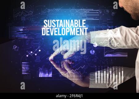 Businessman touching huge screen concept Stock Photo
