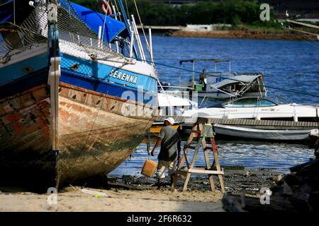 salvador, bahia / brazil - january 5, 2017: boats are seen anchored at the pier in the Ribeira neighborhood in the city of Salvador. *** Local Caption Stock Photo