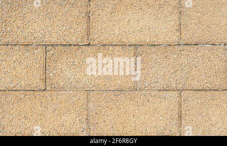 Texture of a gray - brown stone wall close-up. Stone wall background. Concrete surface backdrop. High quality photo Stock Photo