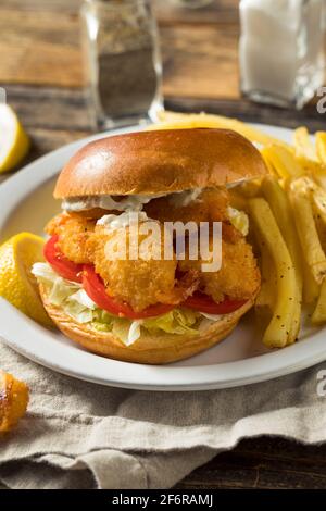 Homemade Fried Shrimp Sandwich with Coleslaw and Fries Stock Photo
