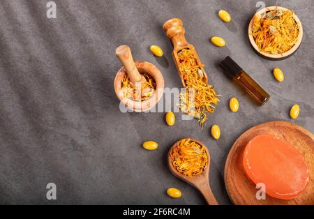 Calendula alternative medicine. Essential oil, soap and pills - Calendula officinalis. Stock Photo