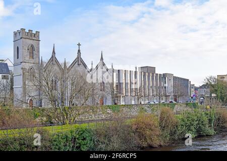 River Corrid passing through the beautiful city of Galway with a church and historic buildings on its left bank, Galway, Ireland Stock Photo