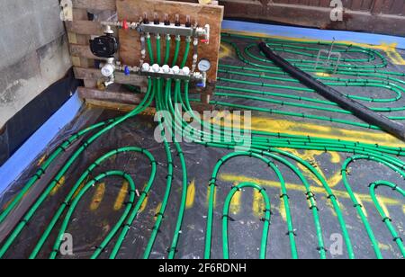 Control panel for hydronic underfloor heating system under leak and pressure test before pipes are covered in self levelling compound Stock Photo