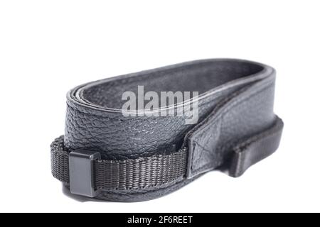 Black leather camera strap isolated on white background. Stock Photo