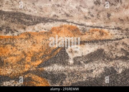 Old marble stone floor tile with abstract orange or brown pattern granite wall texture background. Stock Photo
