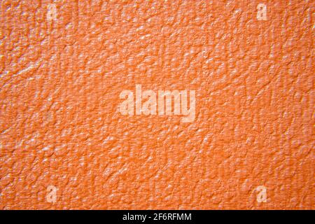 Close up of orange leather texture. Grunge skin fabric background. Stock Photo