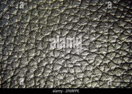 Close up of quality black leather texture. Grunge skin fabric background. Stock Photo