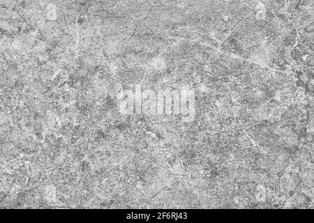 Light gray granite texture of an old stone wall with cracks and scratches grunge background. Stock Photo