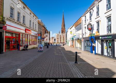 Dumfries, Scotland, UK. 2 April 2021. On the day when Scottish Government relaxes lockdown rules from “Stay at Home” to “Stay Local” the shopping streets of Dumfries town centre remain almost deserted with virtually no shops or businesses trading. Pic;  High Street is very quiet despite the sunny spring weather. Iain Masterton/Alamy Live News Stock Photo