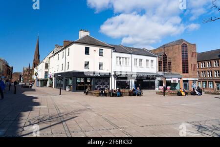 Dumfries, Scotland, UK. 2 April 2021. On the day when Scottish Government relaxes lockdown rules from “Stay at Home” to “Stay Local” the shopping streets of Dumfries town centre remain almost deserted with virtually no shops or businesses trading. Pic;  Square on High Street is very quiet despite the sunny spring weather. Iain Masterton/Alamy Live News Stock Photo