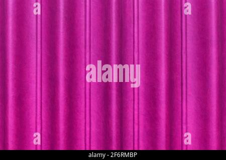 Sliding door, purple or pink curtain scene from the leather of the conference room in the hotel. Wavy abstract pattern wall texture background. Stock Photo