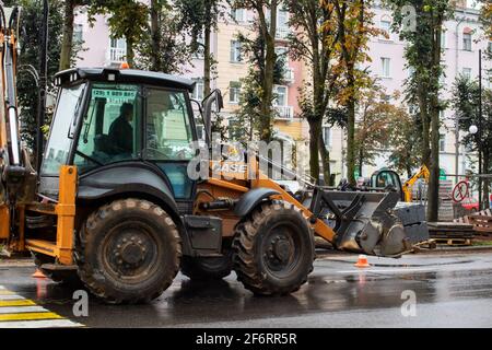 BELARUS, VITEBSK - SEPTEMBER 10, 2020: Excavator rides on the road in the city center Stock Photo