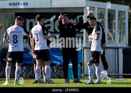 Haverfordwest County manager Wayne Jones instructs his players during a break in play  Penybont v Haverfordwest County at Bryntirion Park in the JD Cy Stock Photo
