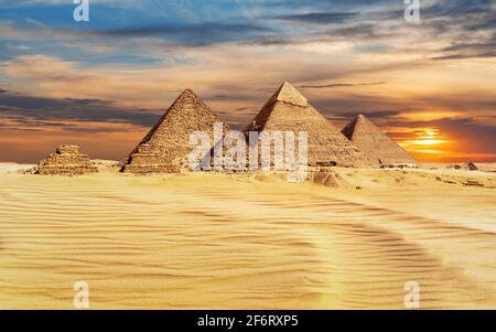 Pyramids of Egypt at sunset, famous Wonder of the World, Giza.