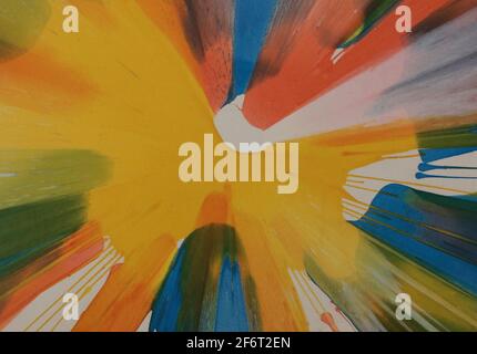 Abstract background image of brightly coloured paints radiating from centre Stock Photo