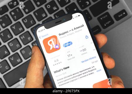 Kharkov, Ukraine - April 2, 2021: Man using Apple iPhone with Yandex application Stock Photo