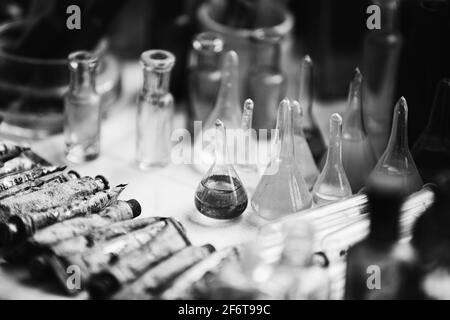 Many Old Deutsch Vintage Medical Glass Capacity. Detail Of Retro Chemical Pharmaceutical Science Researches. Small Bottles Different Sizes From Times Stock Photo