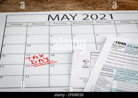 Internal Revenue Service (IRS) has extended the deadline for filing US federal income tax until May 17 2021. Concept image showing a calendar page mar Stock Photo