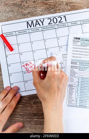 Internal Revenue Service (IRS) has extended the deadline for filing US federal income tax until May 17 2021. Concept image showing a calendar page mar Stock Photo