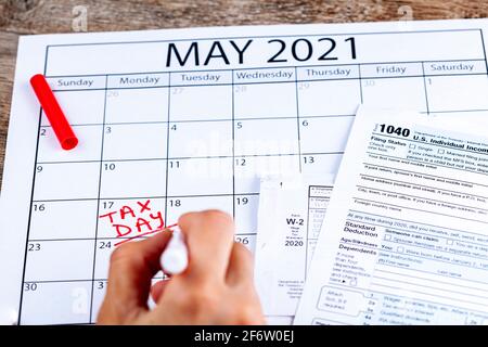 Internal Revenue Service (IRS) has extended the deadline for filing US federal income tax until May 17 2021. Concept image showing a calendar page mar Stock Photo