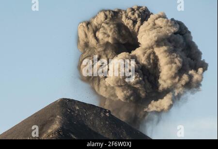 Acatenango, Guatemala. 17th Mar, 2021. Fuego Volcano spews out a gigantic smoke ring as it explodes in eruption in Acatenango, Guatemala on March 17, 2021. Credit: Josh Edelson/ZUMA Wire/Alamy Live News Stock Photo