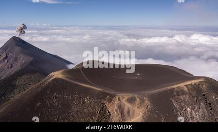 Aerial view of the erupting Fuego volcano with smoke and explosion ...