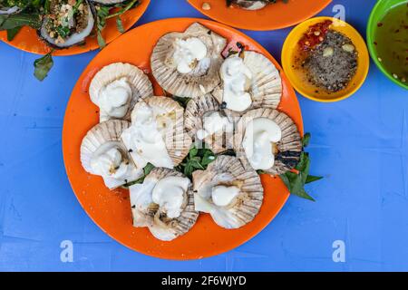 Vietnam styled grilled scallops and creamy cheese on the top Stock Photo