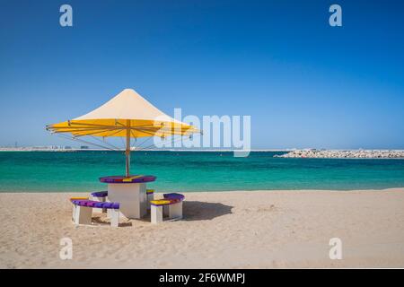 Beach umbrella and seats on the seaside Stock Photo