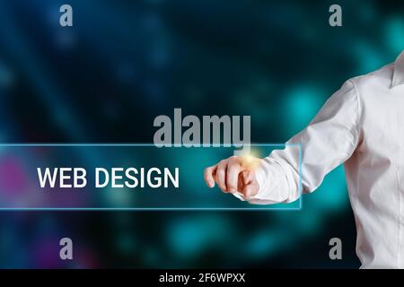 Male hand pressing the word web design on a virtual search display bar. Internet technology web design concept. Stock Photo