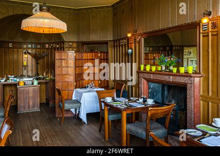 The restaurant in the former dining room with original wood paneling. The small fireplace room can also be booked for an intimate dinner for two! Stock Photo