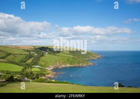 Talland Bay between Looe and Polperro Cornwall UK with blue sea and coastline Stock Photo