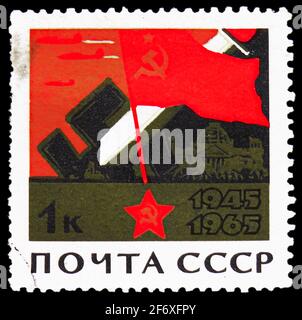 MOSCOW, RUSSIA - JANUARY 11, 2021: Postage stamp printed in USSR (Russia) shows Soviet Flag, Reichstag Building, Broken Swastika, 20th Anniversary of Stock Photo