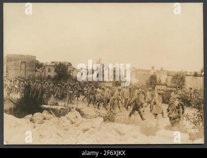The photograph shows French prisoners of war at a designated location ...