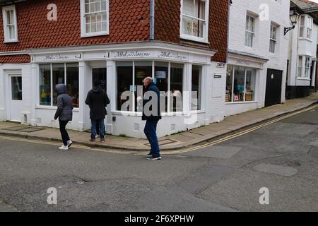 Rye, East Sussex, UK. 03 Apr, 2021. UK Weather: Weekend visitors to the ancient town of Rye in East Sussex wander through the town wrapped up warm as the weather takes a turn. All non essential shops and pubs remaining closed due to covid restrictions. Photo Credit: Paul Lawrenson /Alamy Live News Stock Photo